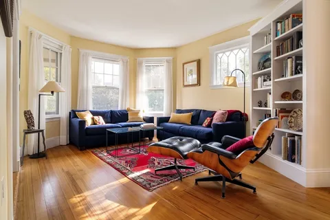 a living room with furniture or wooden floor and a window