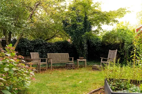 a view of a chairs and table in the patio