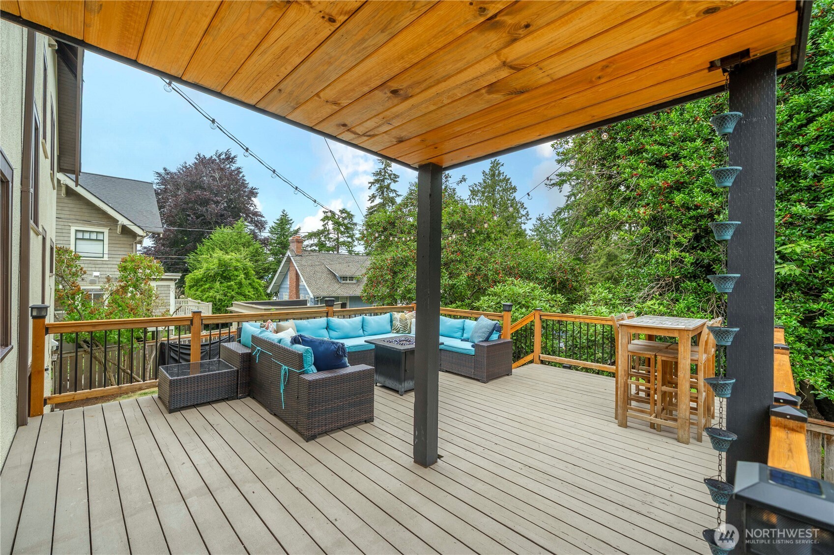 15 North Orchard Road Tacoma, WA 98406 - Photo 33 of 39 a balcony with wooden floor and outdoor seating