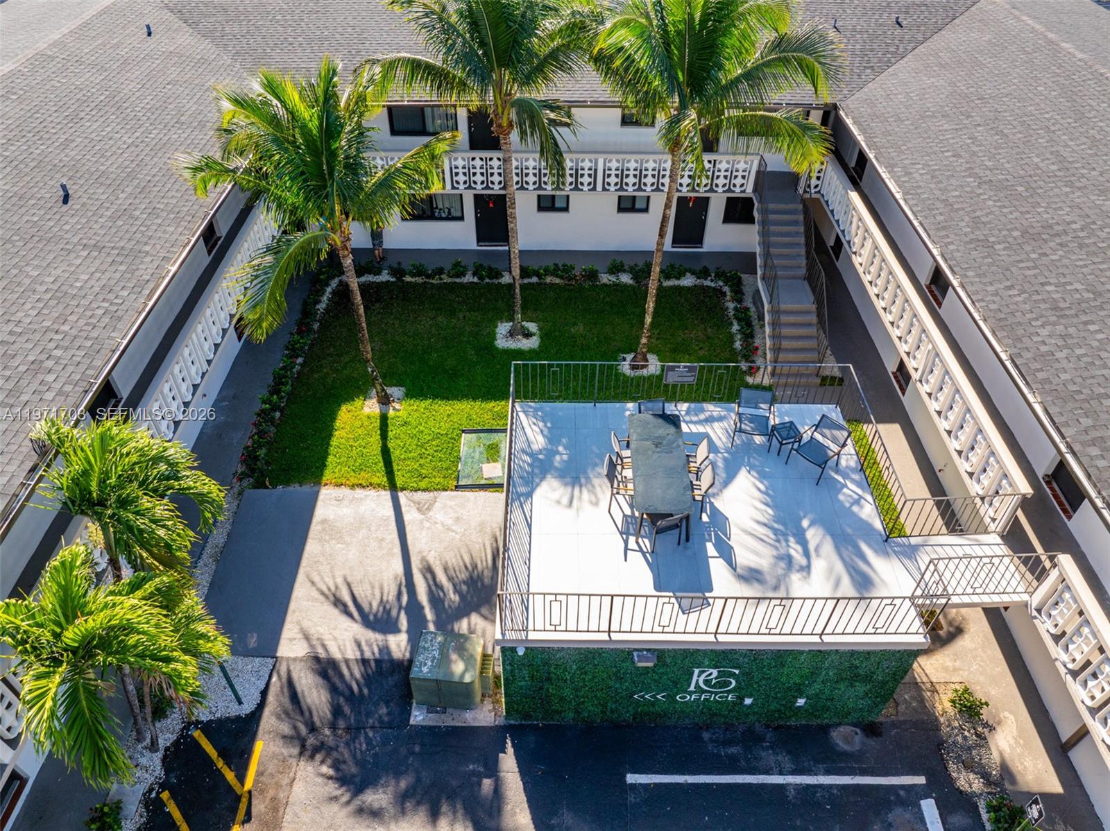 1330 West 29th Street, Unit 39 Hialeah, FL 33012 - Photo 2 of 17 a view of an chairs and table in the balcony