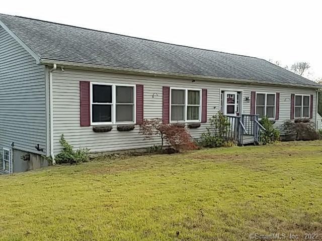 108 Putnam Road Plainfield, CT 06332 - Photo 1 of 1 a house that has a large pool in front of it