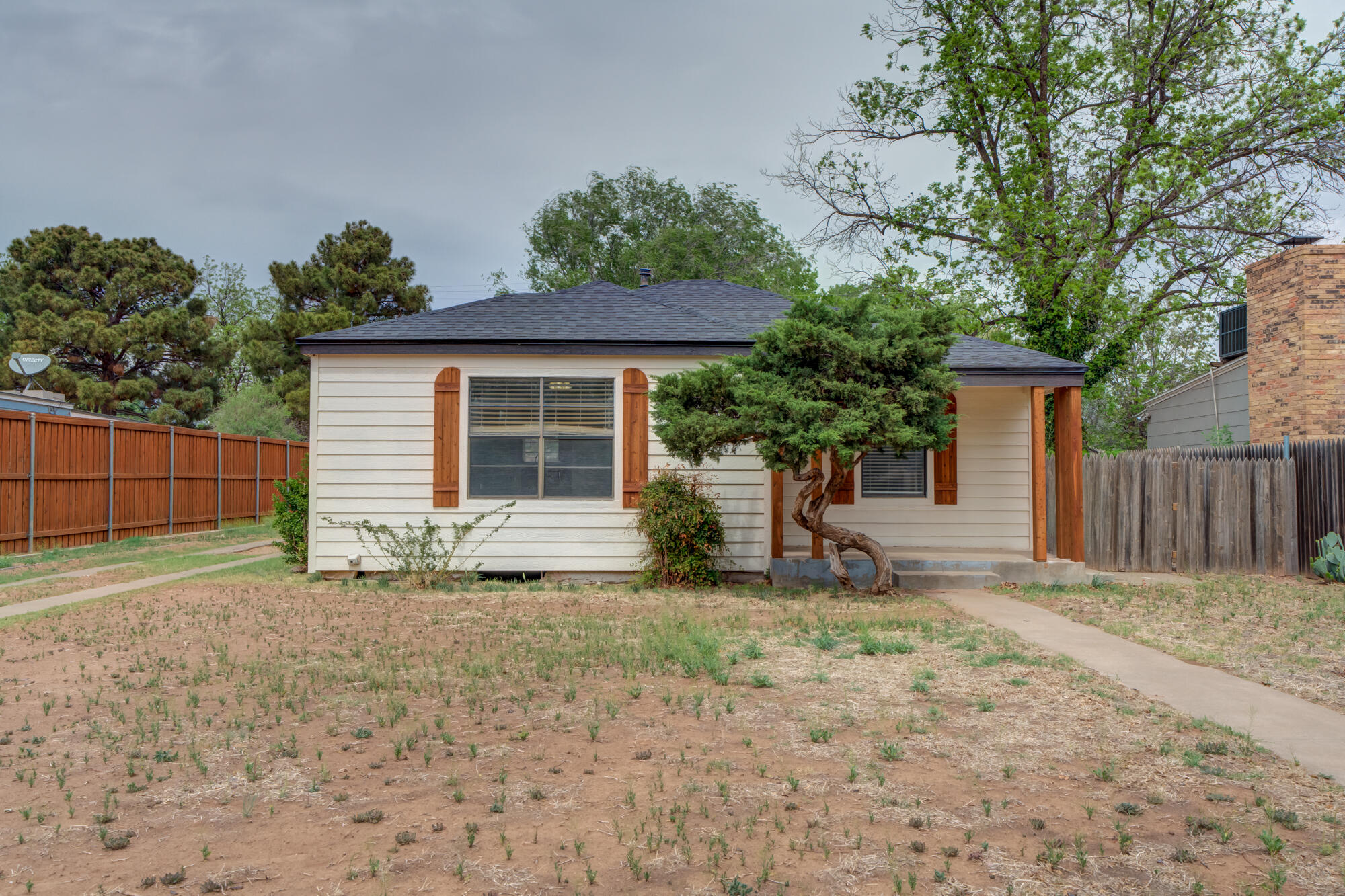 2308 30th Street Lubbock, TX 79411 - Photo 2 of 21 a house that has a tree in front of it