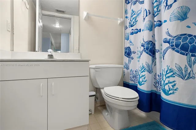 a bathroom with a toilet and a sink