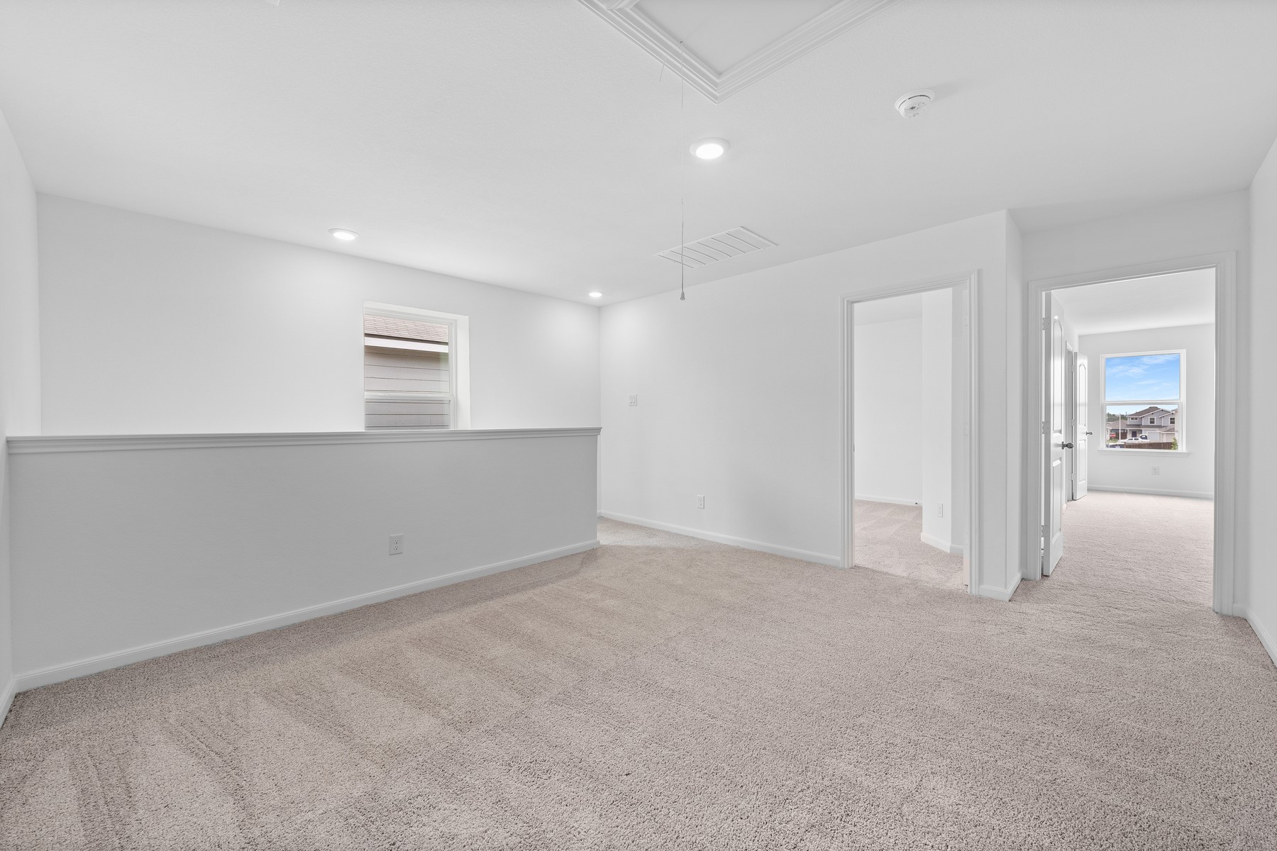 345 Silent Meadow Run Maxwell, TX 78656 - Photo 3 of 11 Spare room with light colored carpet and recessed lighting