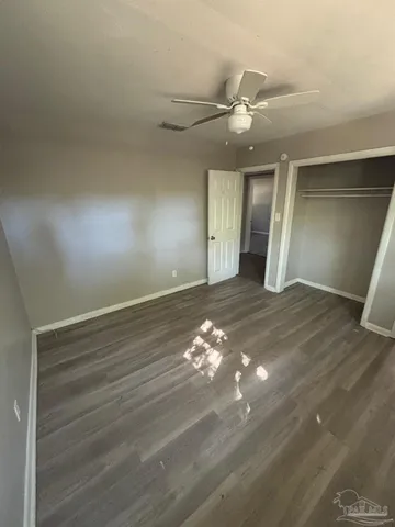 a view of a livingroom with wooden floor