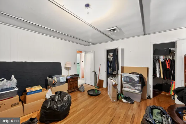 a view of a livingroom with furniture and gym equipment