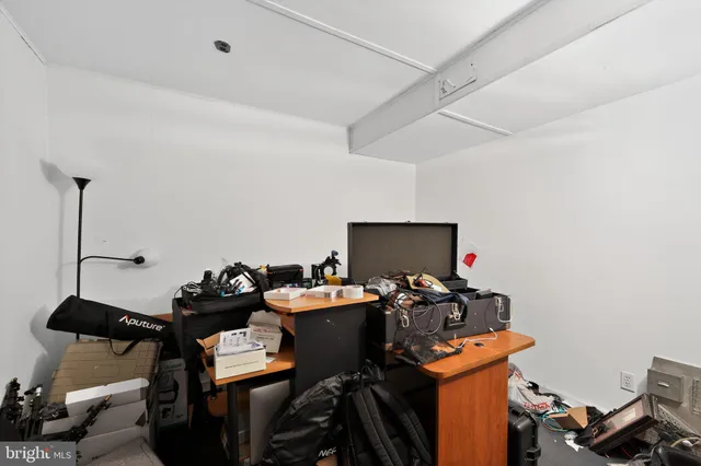 a room with gym equipment and a large window