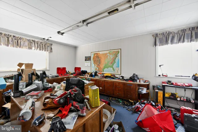 a kitchen with refrigerator and cabinets