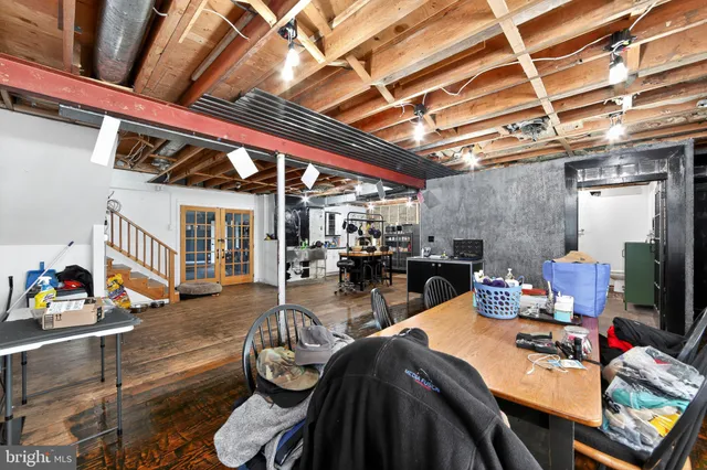 a living room with stainless steel appliances kitchen island granite countertop furniture and a kitchen view
