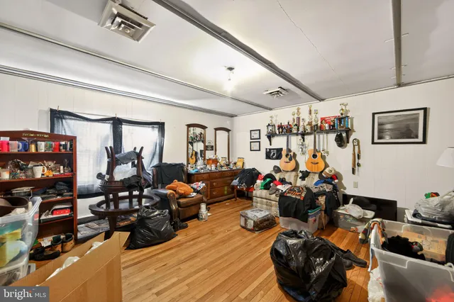 a bed room with furniture and a window