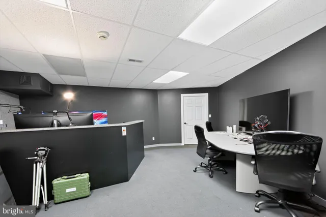 a gym room with lots of gym equipment