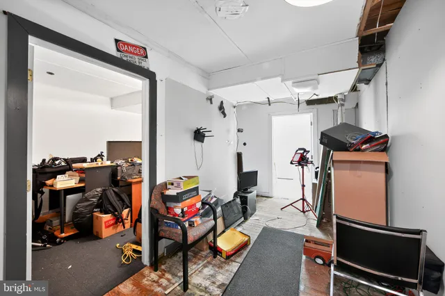 a view of a patio with table and chairs