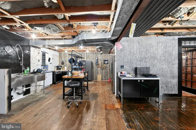 a view of a livingroom with furniture and a window