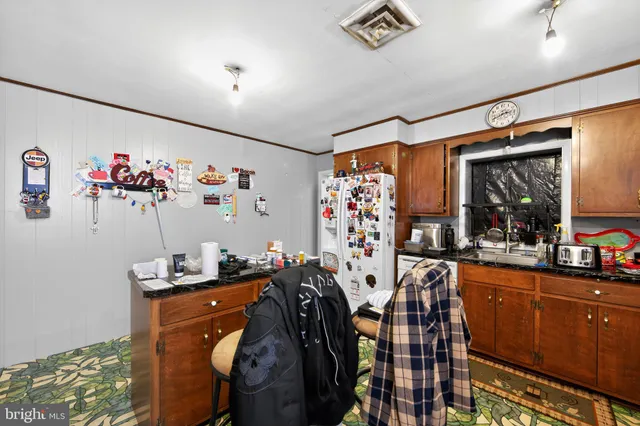 a view of a livingroom with furniture and a window