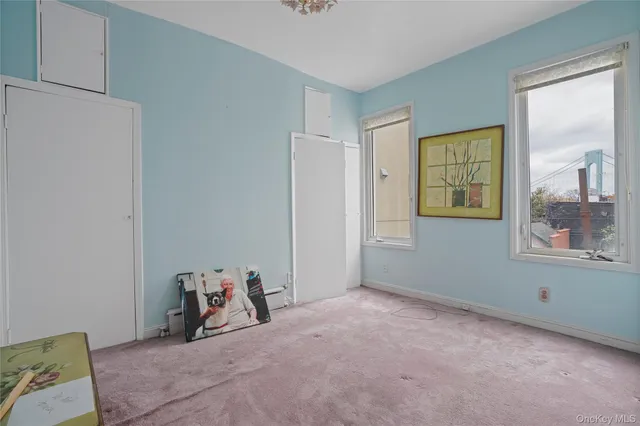 a room with a bed and a window