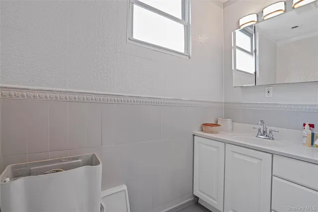 a bathroom with a sink and cabinets