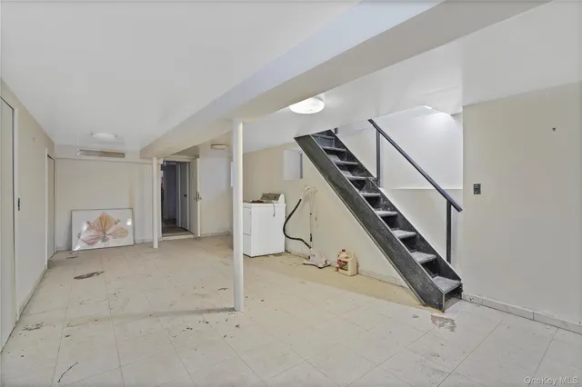 a room with gym equipment and white walls