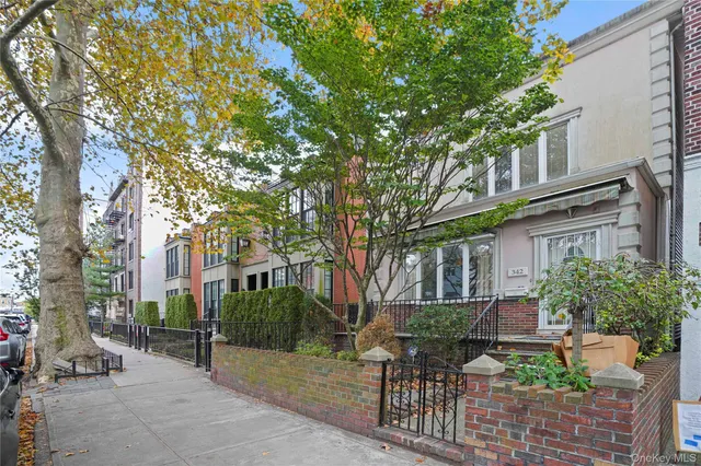 a house view with a sitting space and garden