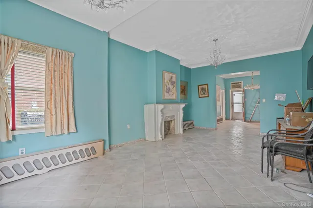 a view of livingroom with furniture window and front door