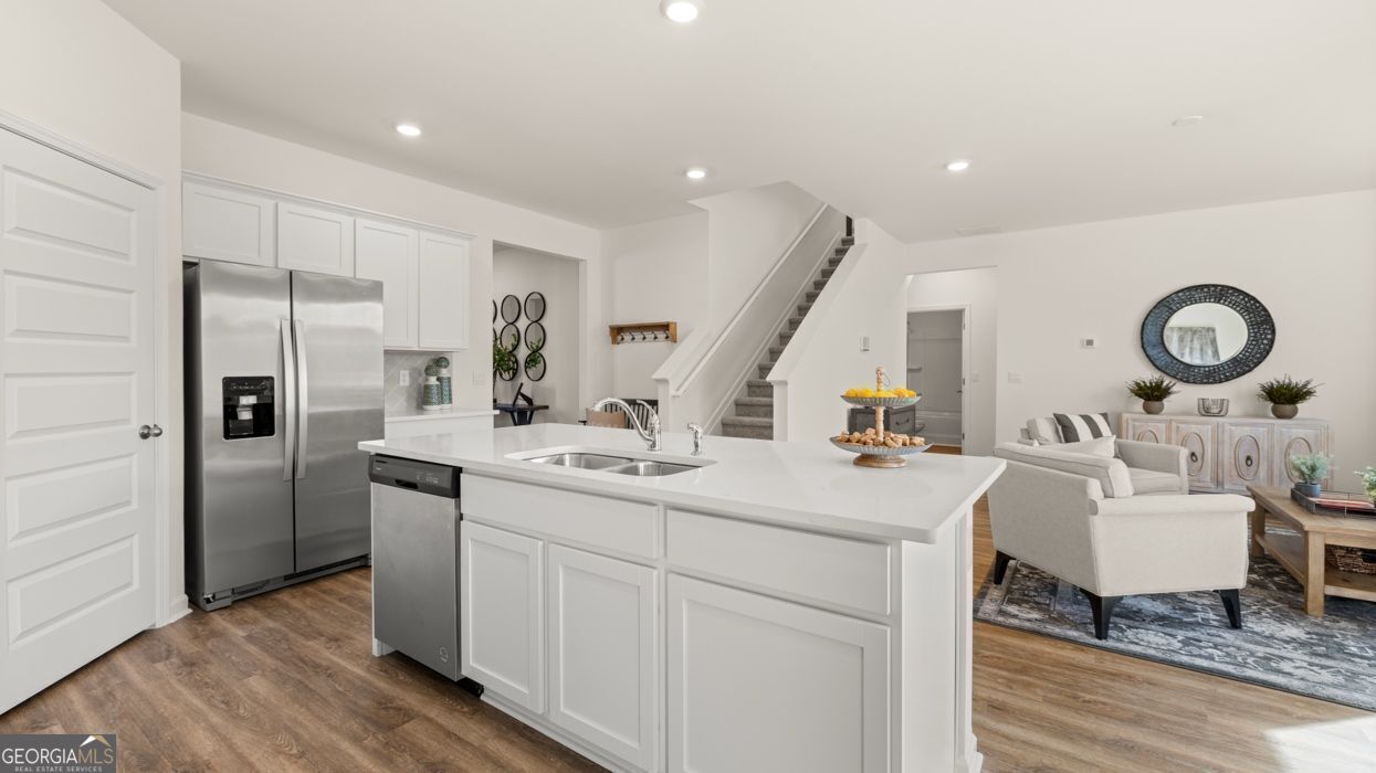 617 Lobelia Way Locust Grove, GA 30248 - Photo 11 of 44 a kitchen with a sink appliances and cabinets