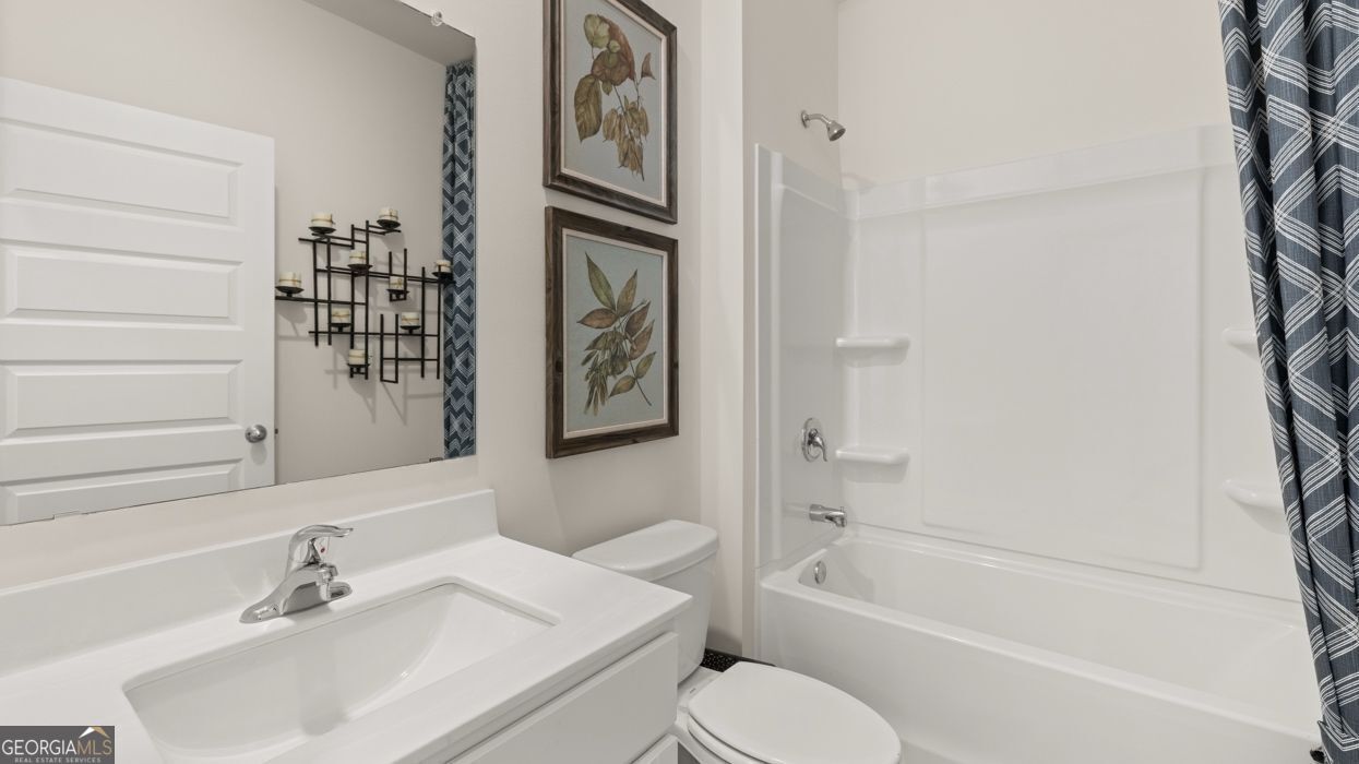 617 Lobelia Way Locust Grove, GA 30248 - Photo 23 of 44 a bathroom with a sink toilet and shower