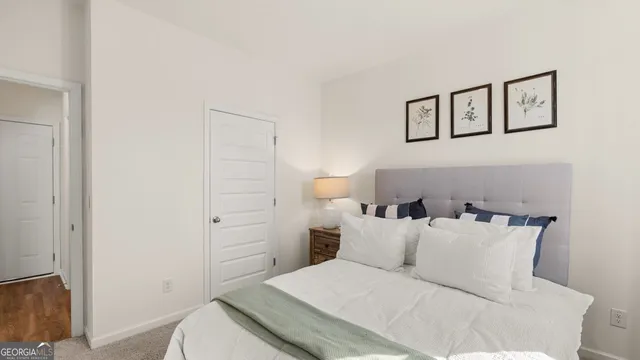 a bedroom with a bed and cabinets