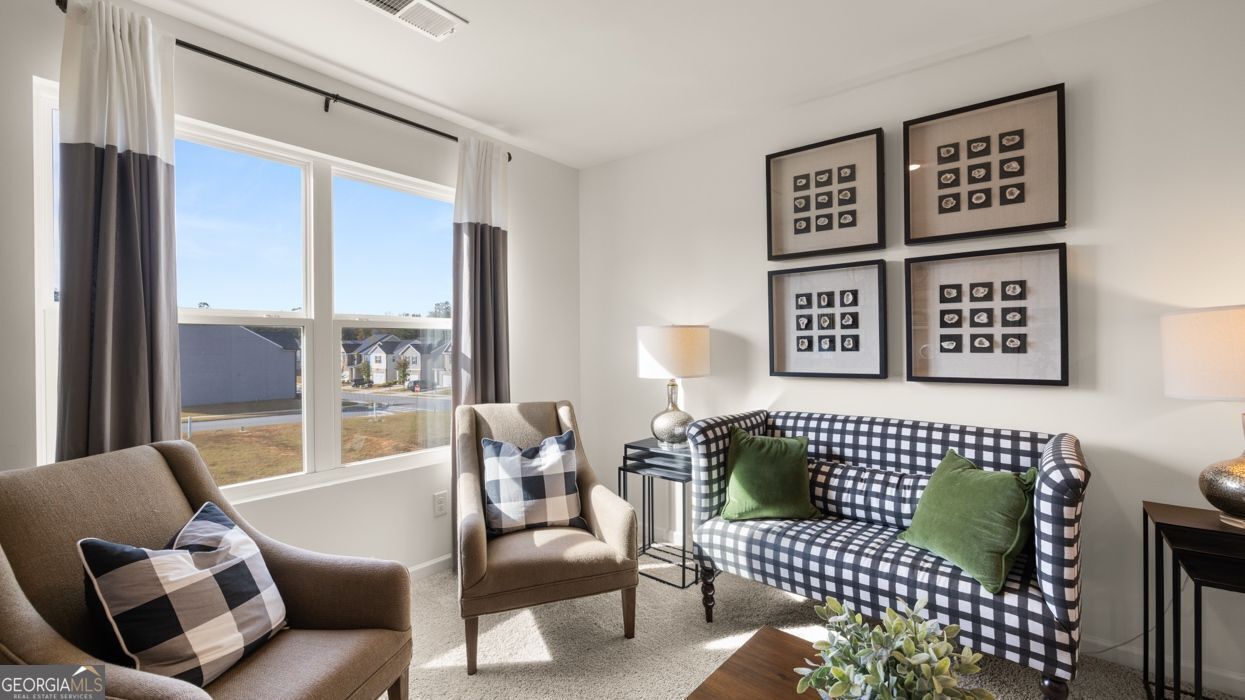 617 Lobelia Way Locust Grove, GA 30248 - Photo 29 of 44 a living room with furniture