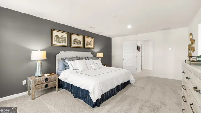 a bedroom with a bed and cabinets