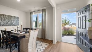 617 Lobelia Way Locust Grove, GA 30248 - Photo 42 of 44 a view of a dining room with furniture and a floor to ceiling window