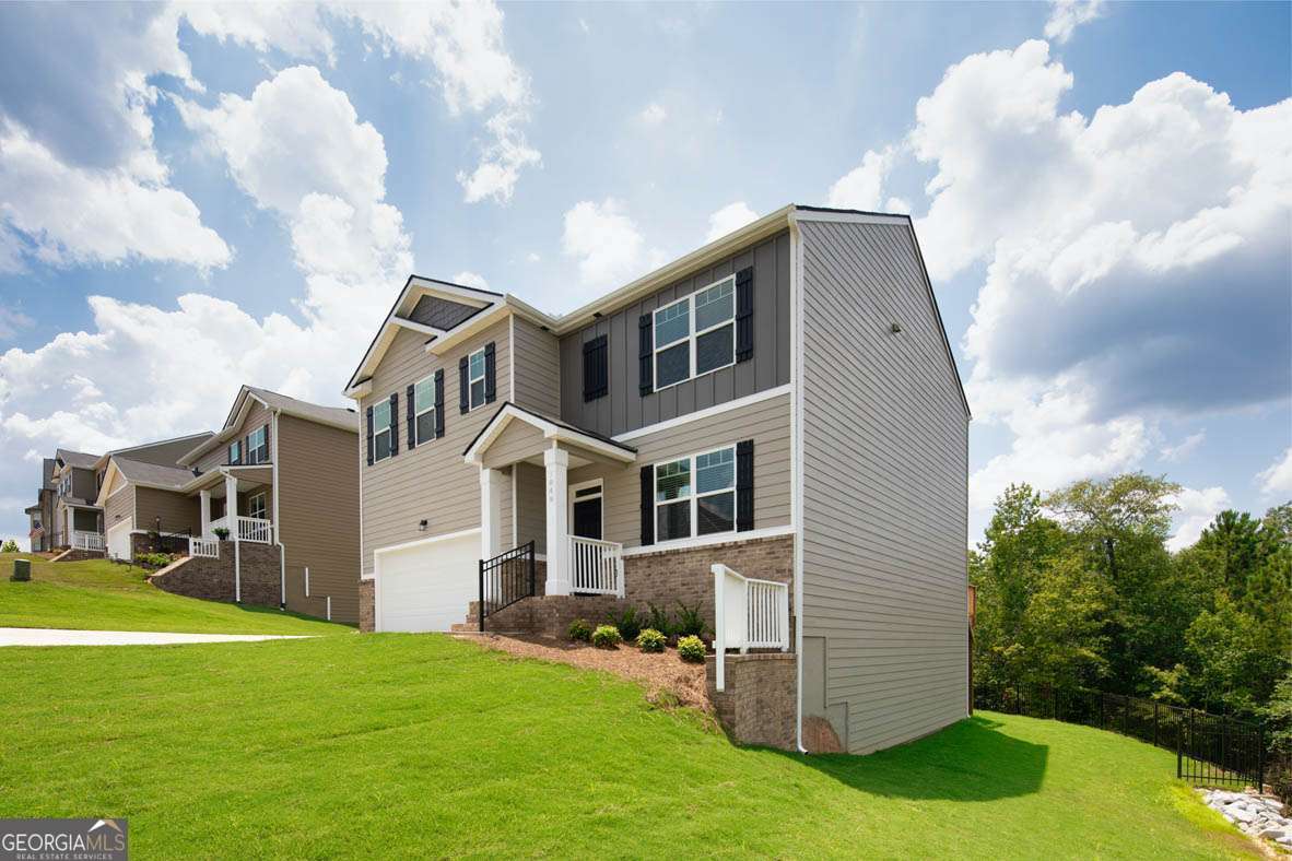 617 Lobelia Way Locust Grove, GA 30248 - Photo 8 of 44 a front view of a house with a yard