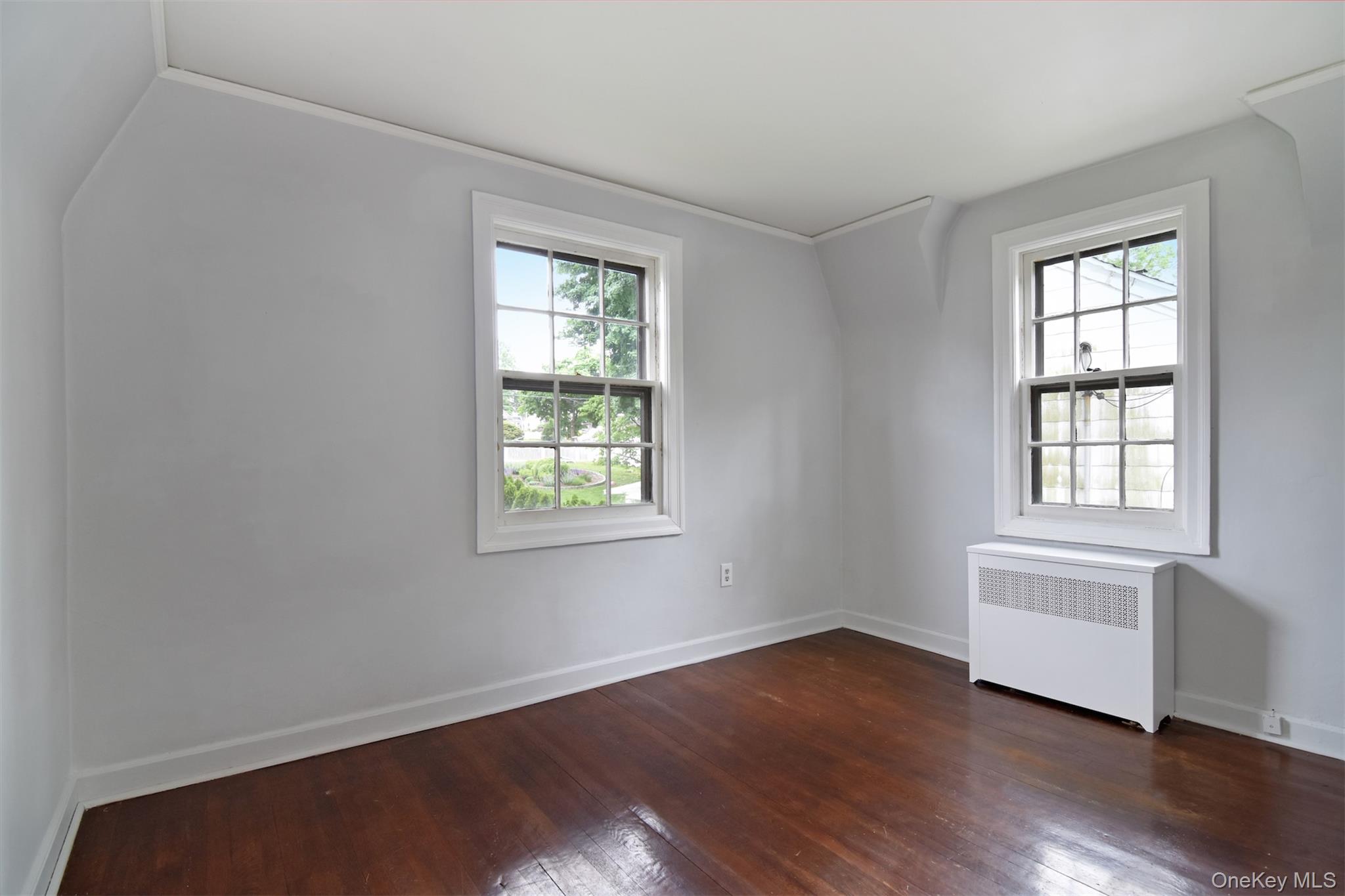 370 Scarsdale Road Tuckahoe, NY 10707 - Photo 23 of 25 Bedroom featuring rich hardwood flooring, light gray wall paint, and white trim
