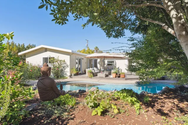 a view of a chairs and tables in the patio