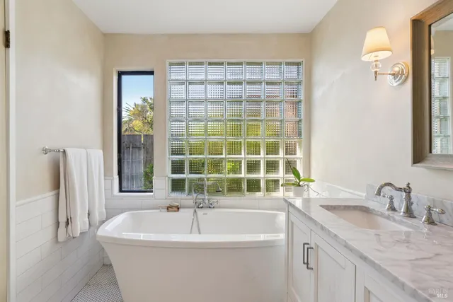 a view of a patio with couches under an umbrella