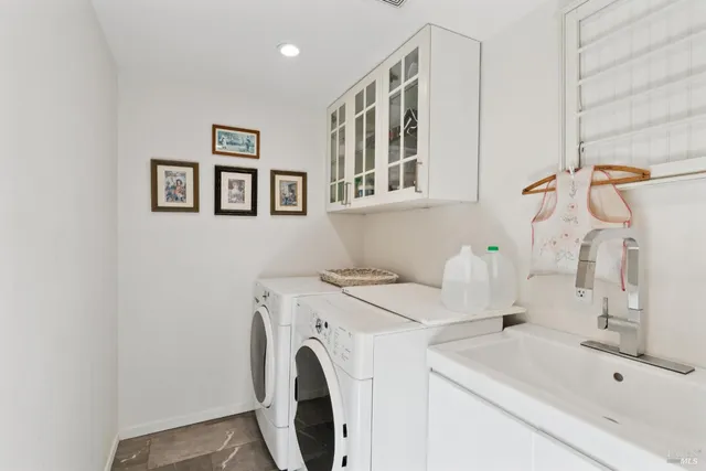 a front view of a house with a fountain