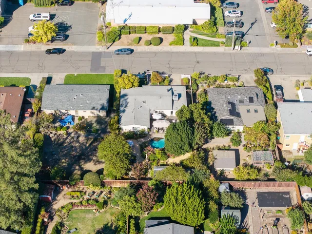 a view of a brick house with a large window