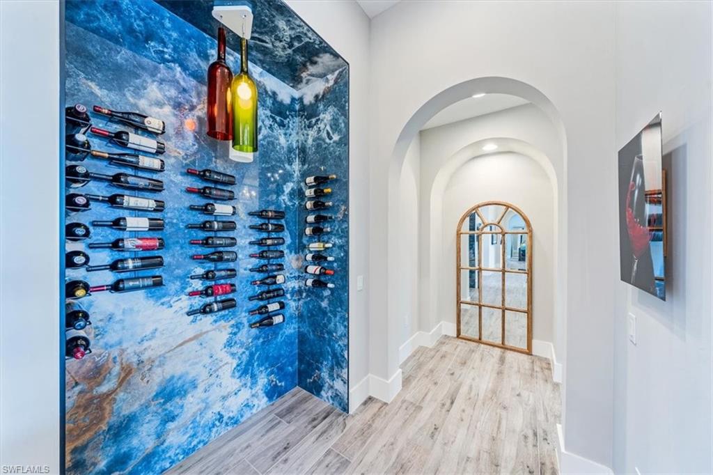 3181 Cullowee Lane Naples, FL 34114 - Photo 16 of 43 a view of entryway with wooden floor