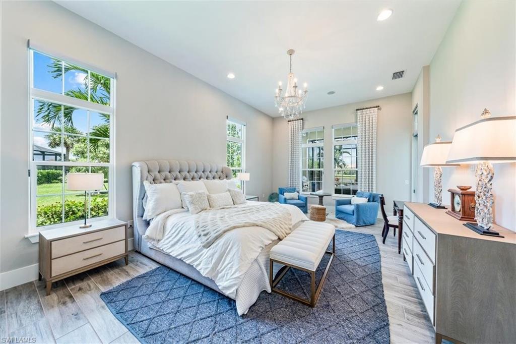 3181 Cullowee Lane Naples, FL 34114 - Photo 17 of 43 a bedroom with a bed and a couch