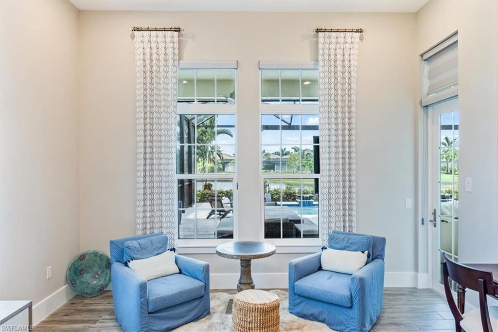 3181 Cullowee Lane Naples, FL 34114 - Photo 18 of 43 a living room with furniture and a window