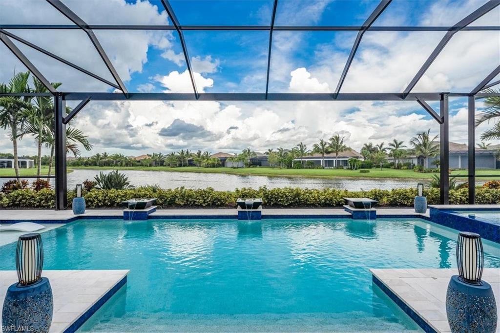 3181 Cullowee Lane Naples, FL 34114 - Photo 2 of 43 a view of a lake with a mountain in the background