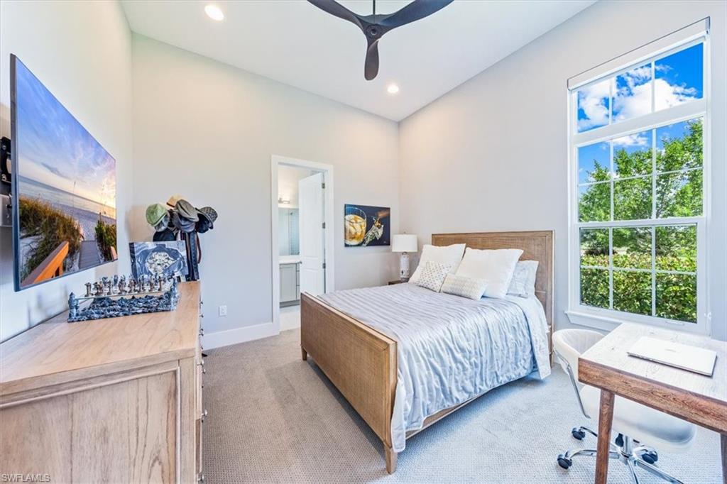 3181 Cullowee Lane Naples, FL 34114 - Photo 27 of 43 a bedroom with a bed and a window