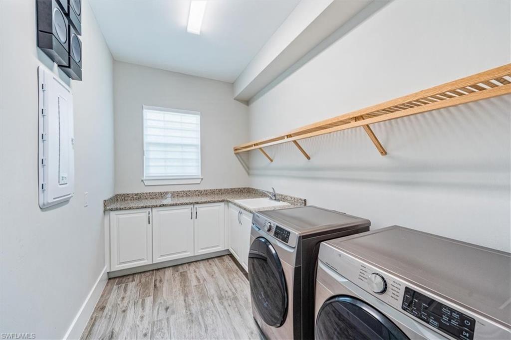 3181 Cullowee Lane Naples, FL 34114 - Photo 30 of 43 a utility room with dryer and washer