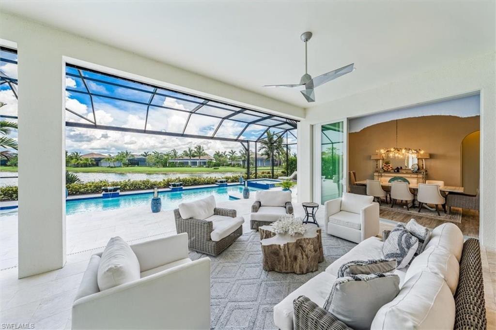 3181 Cullowee Lane Naples, FL 34114 - Photo 32 of 43 a living room with furniture and a large window