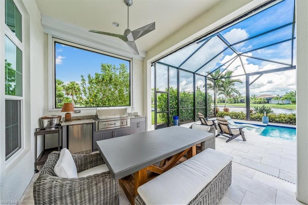 3181 Cullowee Lane Naples, FL 34114 - Photo 35 of 43 a living room with furniture and a large window