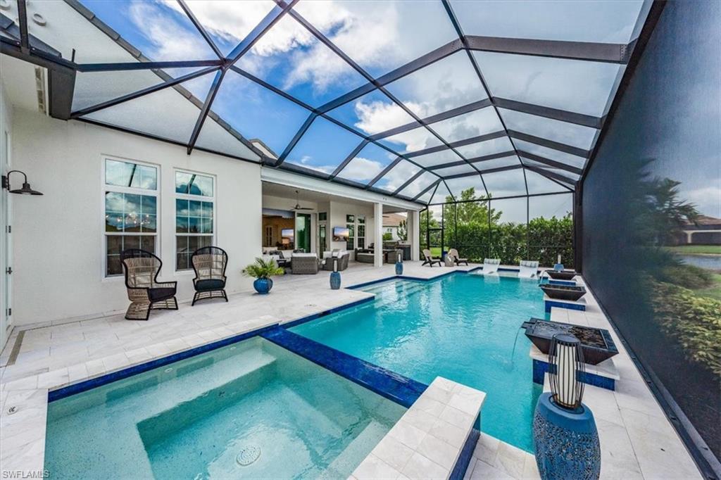 3181 Cullowee Lane Naples, FL 34114 - Photo 38 of 43 a view of a swimming pool with a patio