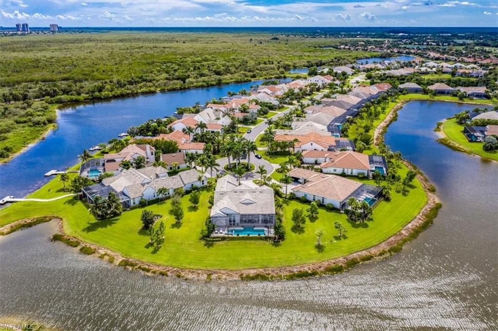 3181 Cullowee Lane Naples, FL 34114 - Photo 43 of 43 a view of a swimming pool with a table and chairs