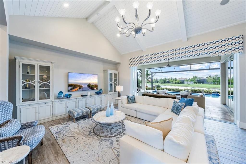 3181 Cullowee Lane Naples, FL 34114 - Photo 6 of 43 a living room with furniture and a large window