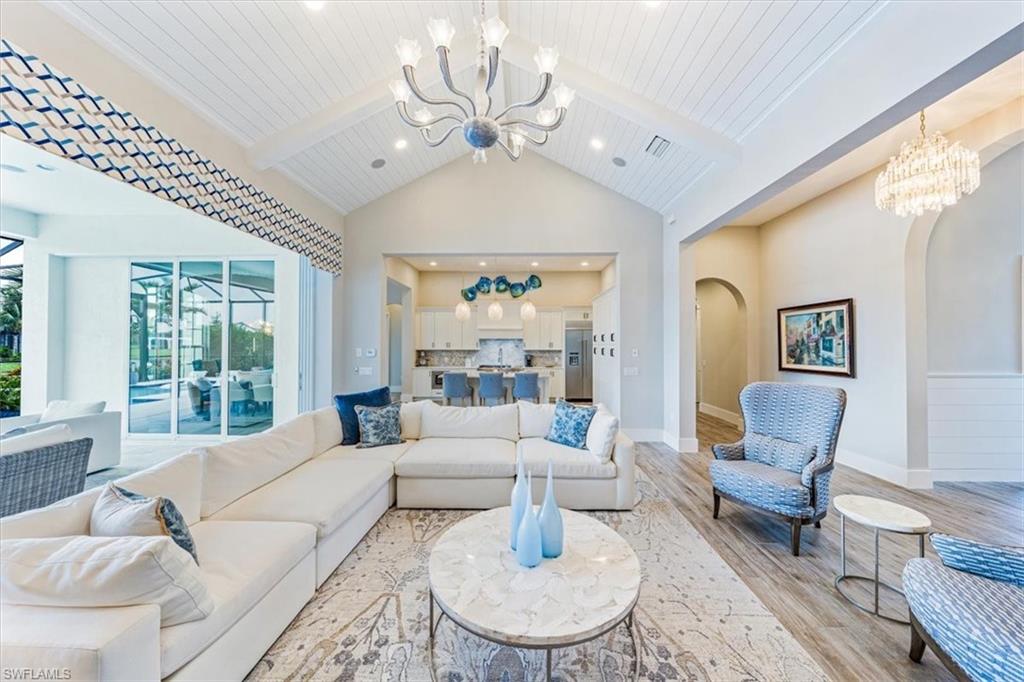 3181 Cullowee Lane Naples, FL 34114 - Photo 9 of 43 a living room with furniture and a large window