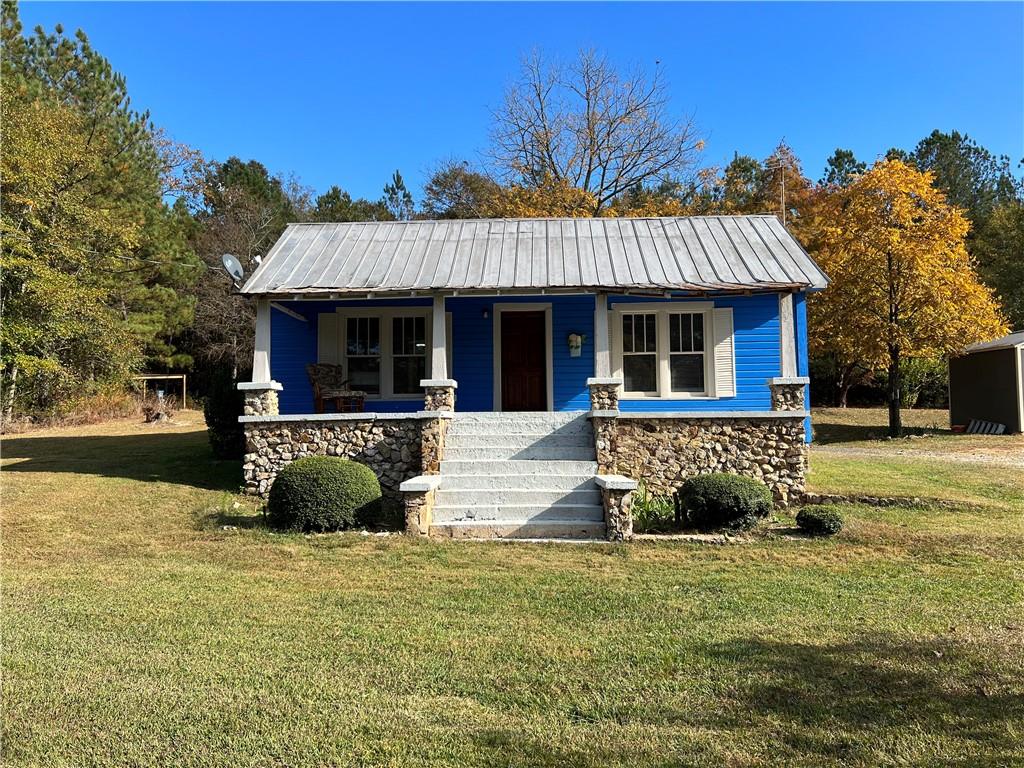181 Barnsley Church Road Kingston, GA 30145 - Photo 1 of 1 a front view of a house with a yard