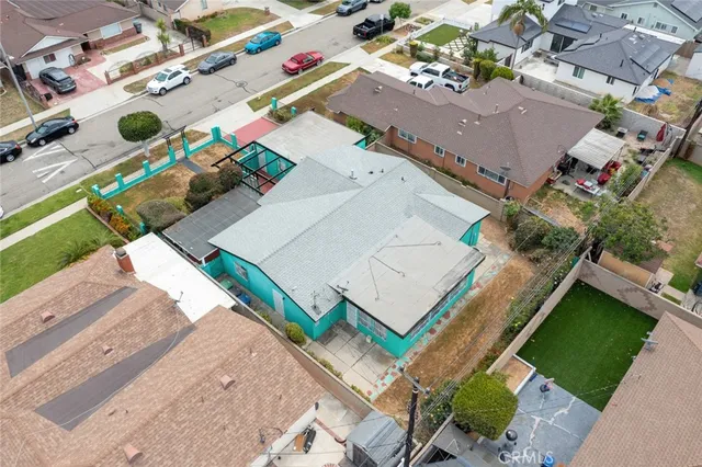 an aerial view of a house with a garden