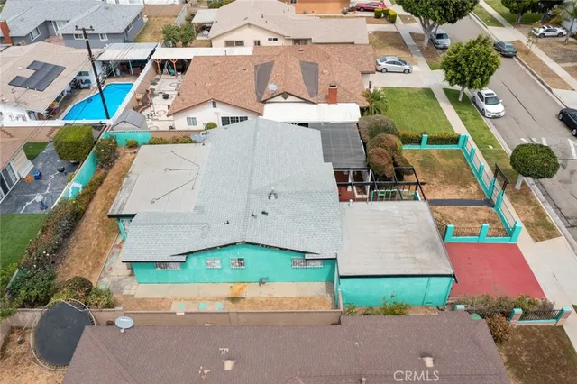 an aerial view of a house with a yard and a garage